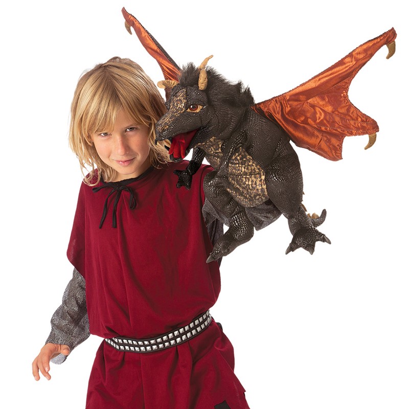 Folkmanis hand puppet black dragon with copper-coloured wings and horns perched on the shoulder of a costumed child