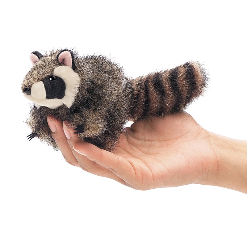 Folkmanis mini raccoon finger puppet with ringed tail, lying on a hand, side view