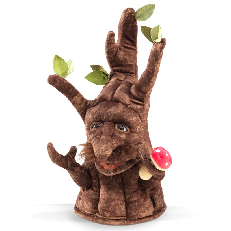 Folkmanis Enchanted Tree hand puppet in brown plush with a face, green fabric leaves and a red fly agaric mushroom, angled view