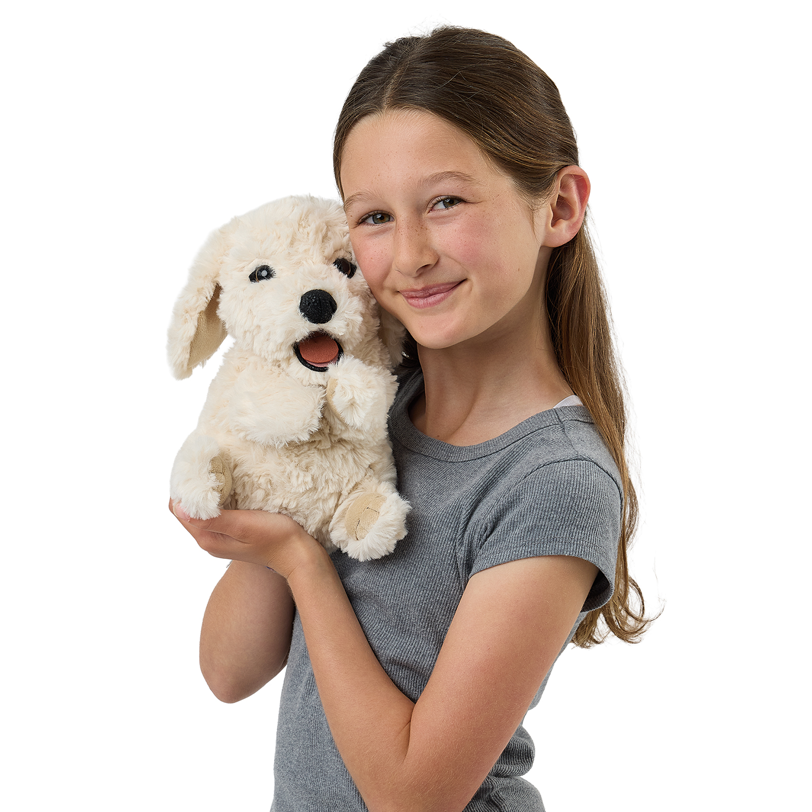 Folkmanis puppy hand puppet on a girl's arm, a front view with its mouth open.
