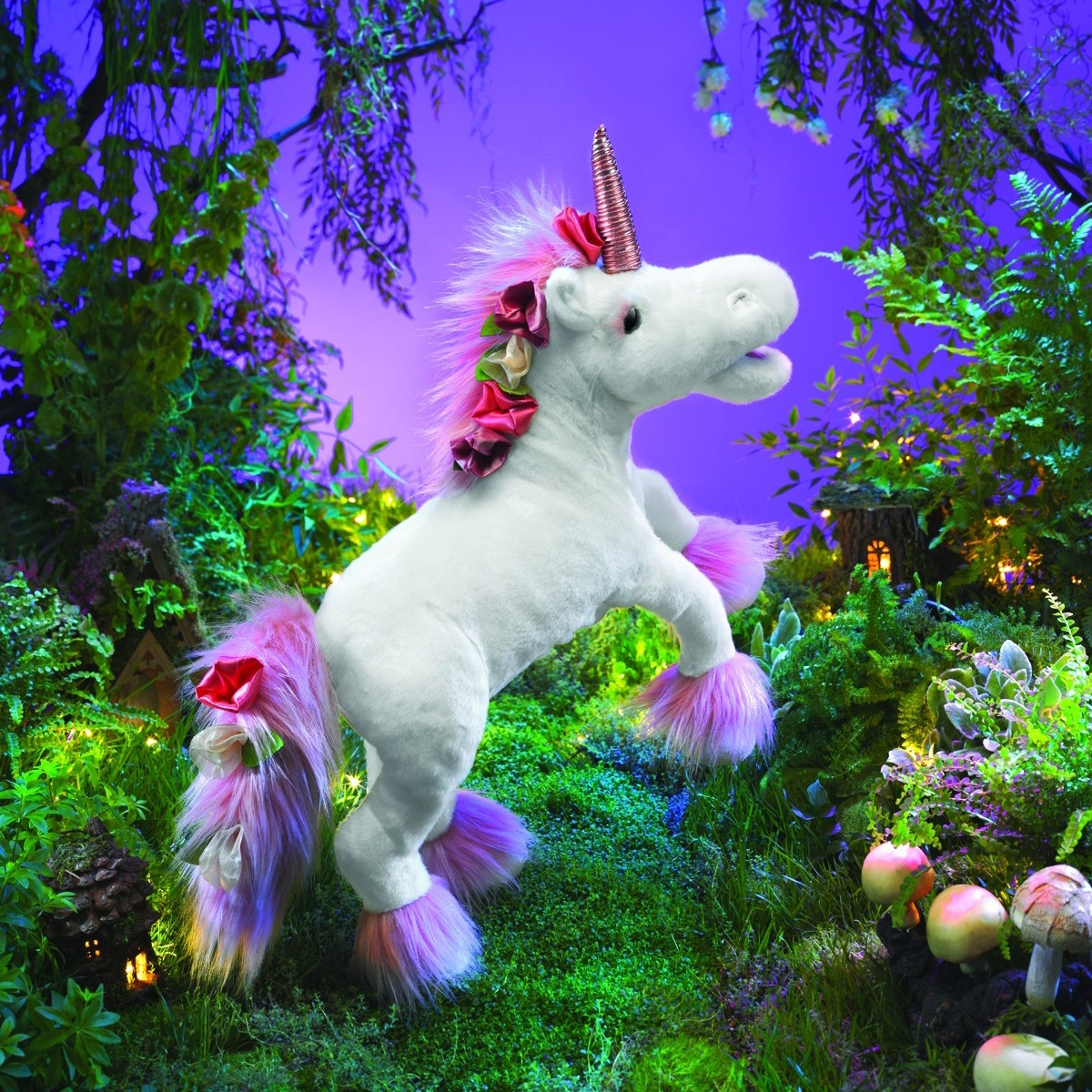 Folkmanis unicorn hand puppet in white with pink fur on the mane and hooves, a copper-coloured horn and silk flowers, posed rearing up