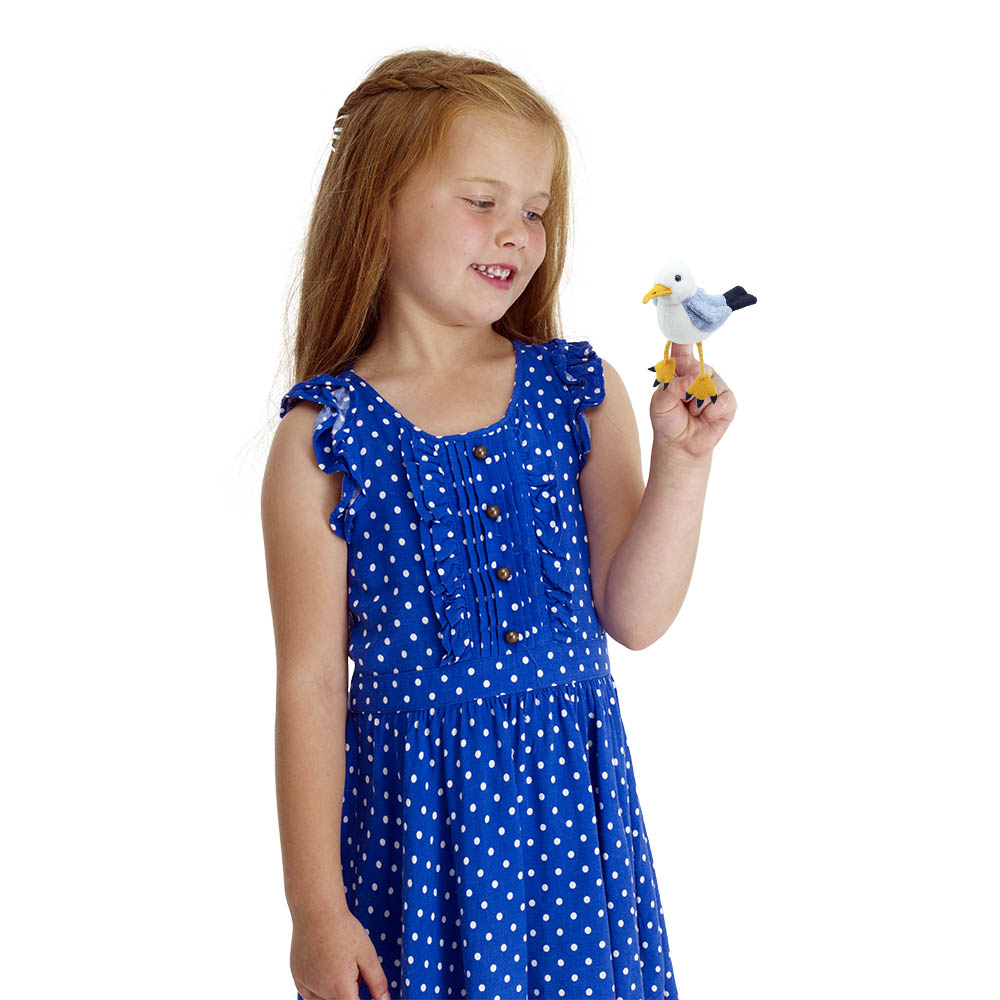 Girl holding the The Puppet Company seagull finger puppet on her hand, usage example