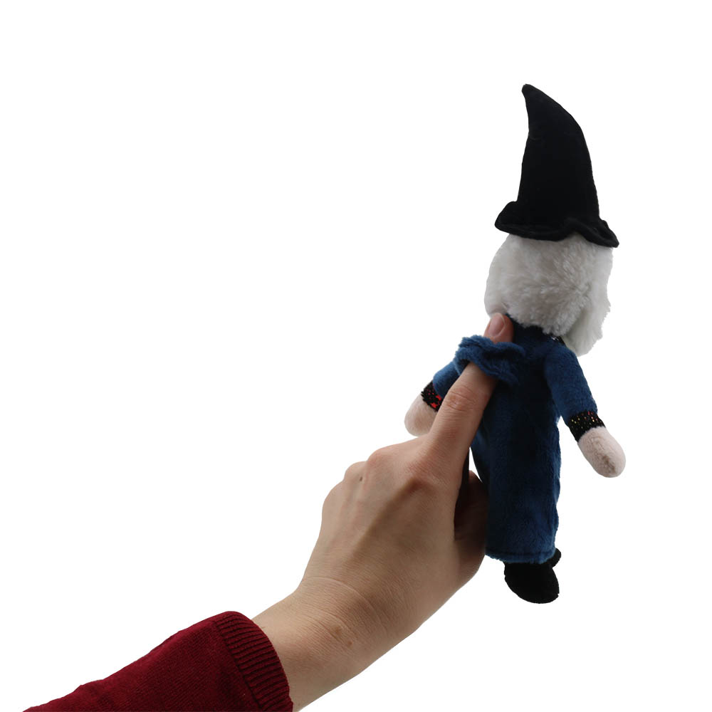 Hand holding the The Puppet Company finger puppet wizard from below, close-up view with the sleeve visible