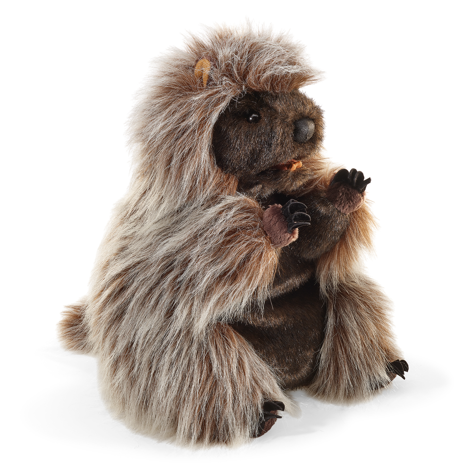 Folkmanis standing porcupine hand puppet, sitting upright in a front view with long shaggy grey-brown fur and a dark face.
