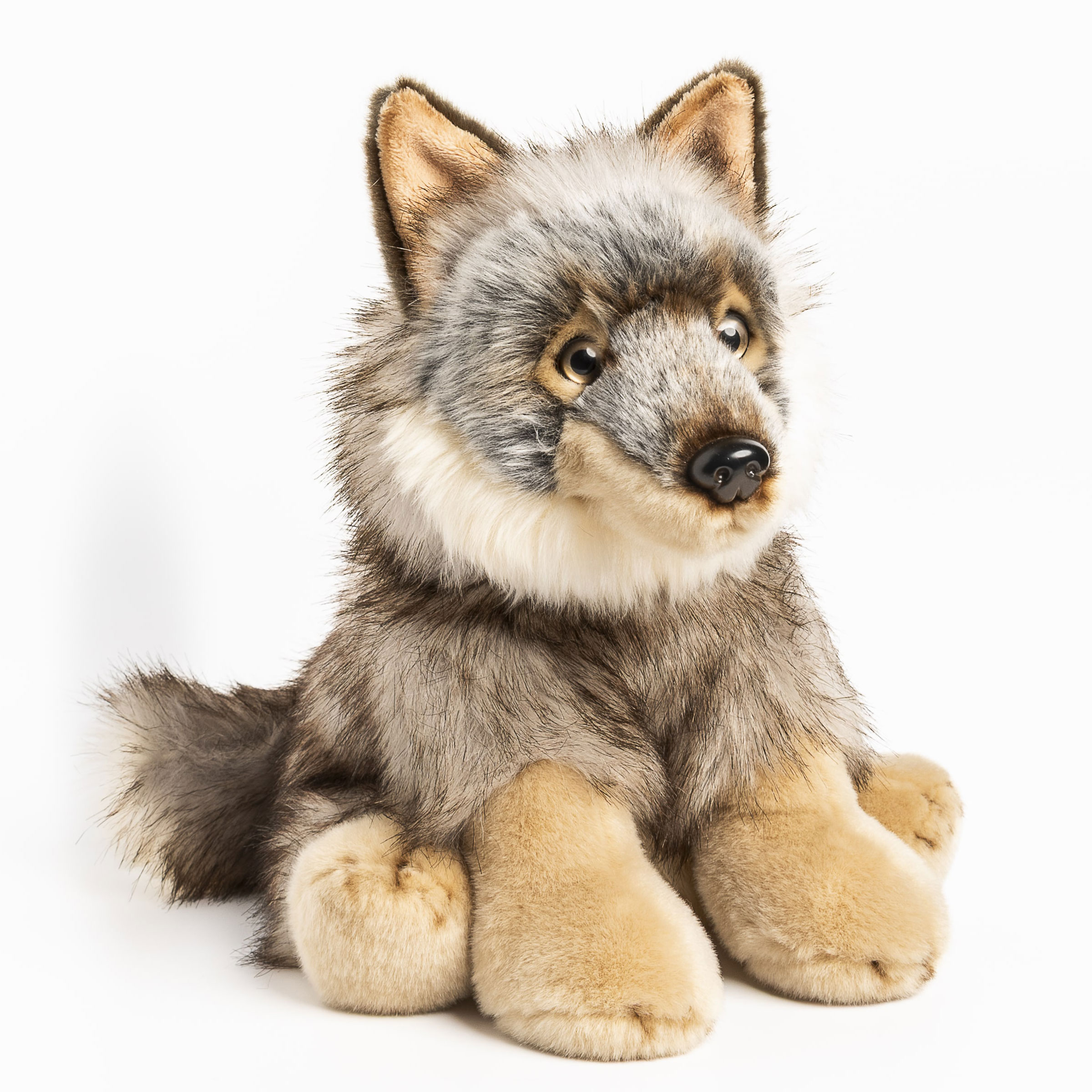 Anima wolf soft toy, seated plush figure with mottled grey fur, light chest, sand-coloured paws and a bushy tail, shown from the front