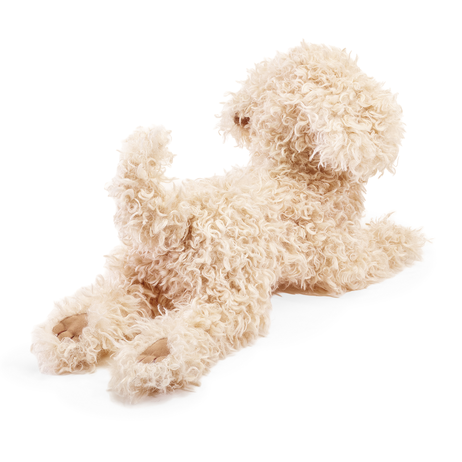 Folkmanis hand puppet poodle puppy in cream white with curly plush fur, photographed lying down from a rear angle