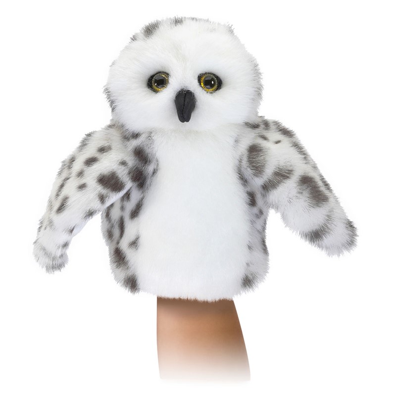 Folkmanis small snowy owl hand puppet with white plush, grey spots and yellow glass eyes, shown being operated on a hand