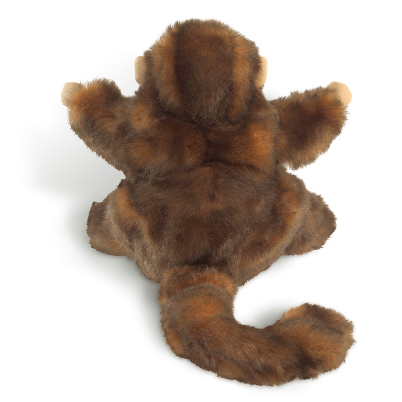 Folkmanis monkey hand puppet seen from behind: brown-mottled plush fur, outstretched arms and a long curved tail