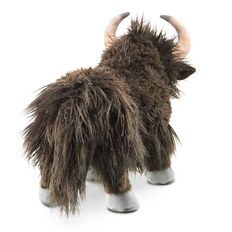 Folkmanis yak hand puppet with shaggy dark brown fur, curved horns and silver-grey hooves, shown from a rear three-quarter angle