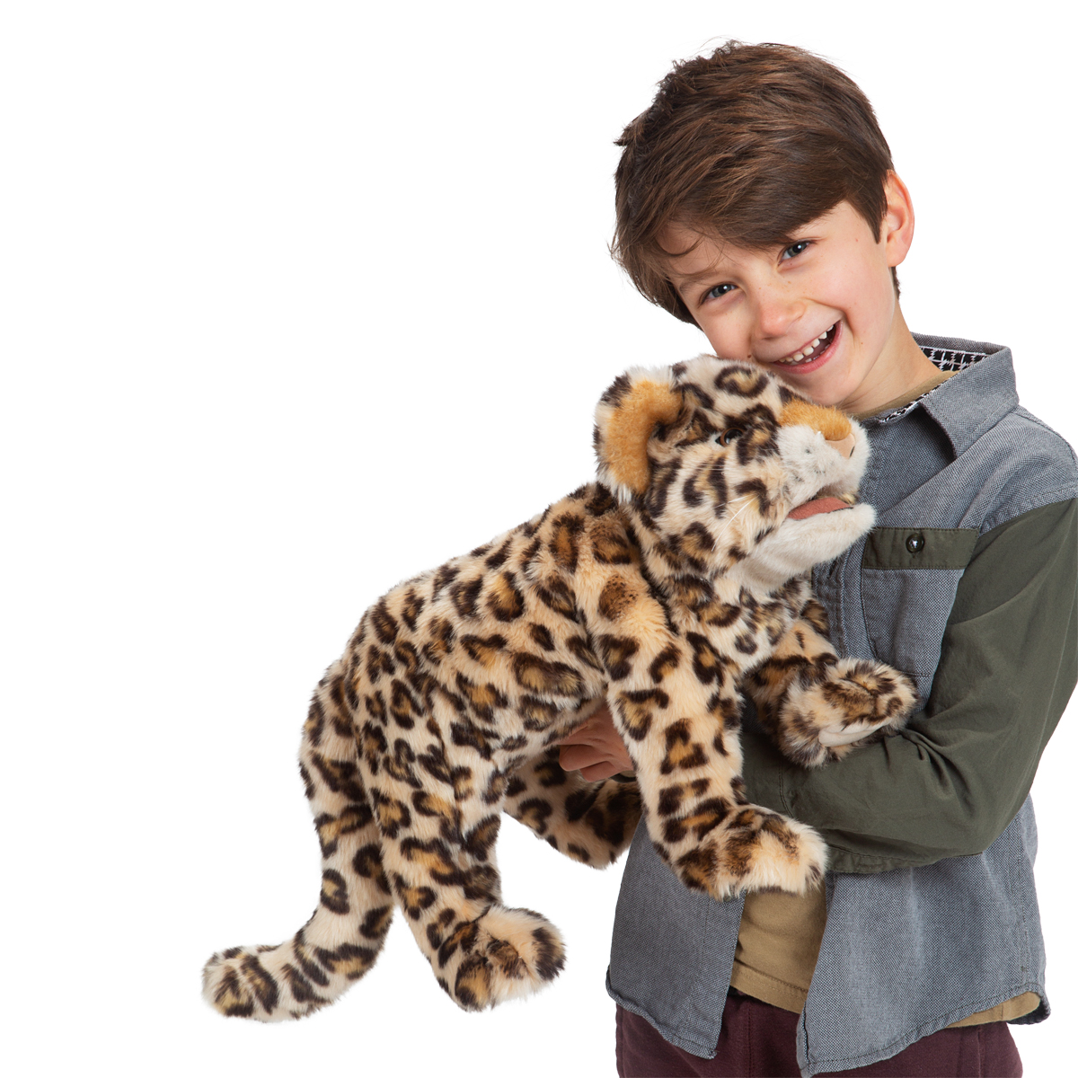 Laughing boy holding the Folkmanis leopard cub hand puppet with beige fur and dark spots in his arms