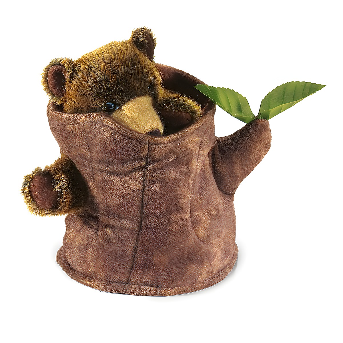 Folkmanis hand puppet bear in a brown plush tree stump, bear peeks out with paws and golden snout, green leaves on the side