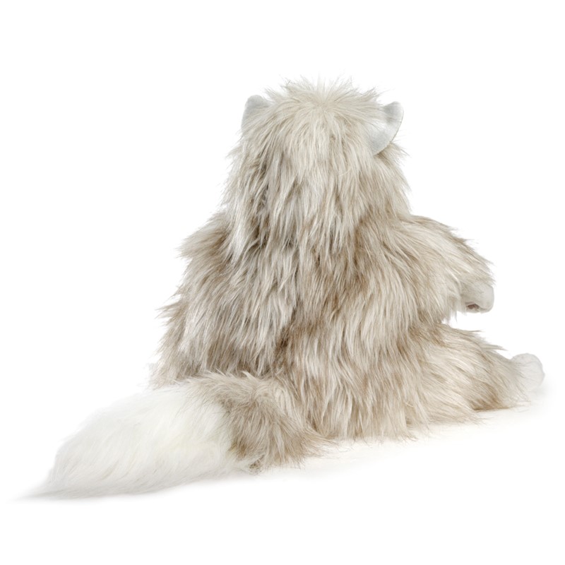 Folkmanis fluffy cat hand puppet seen from behind with long beige-grey fur, white tail and silver-grey ears
