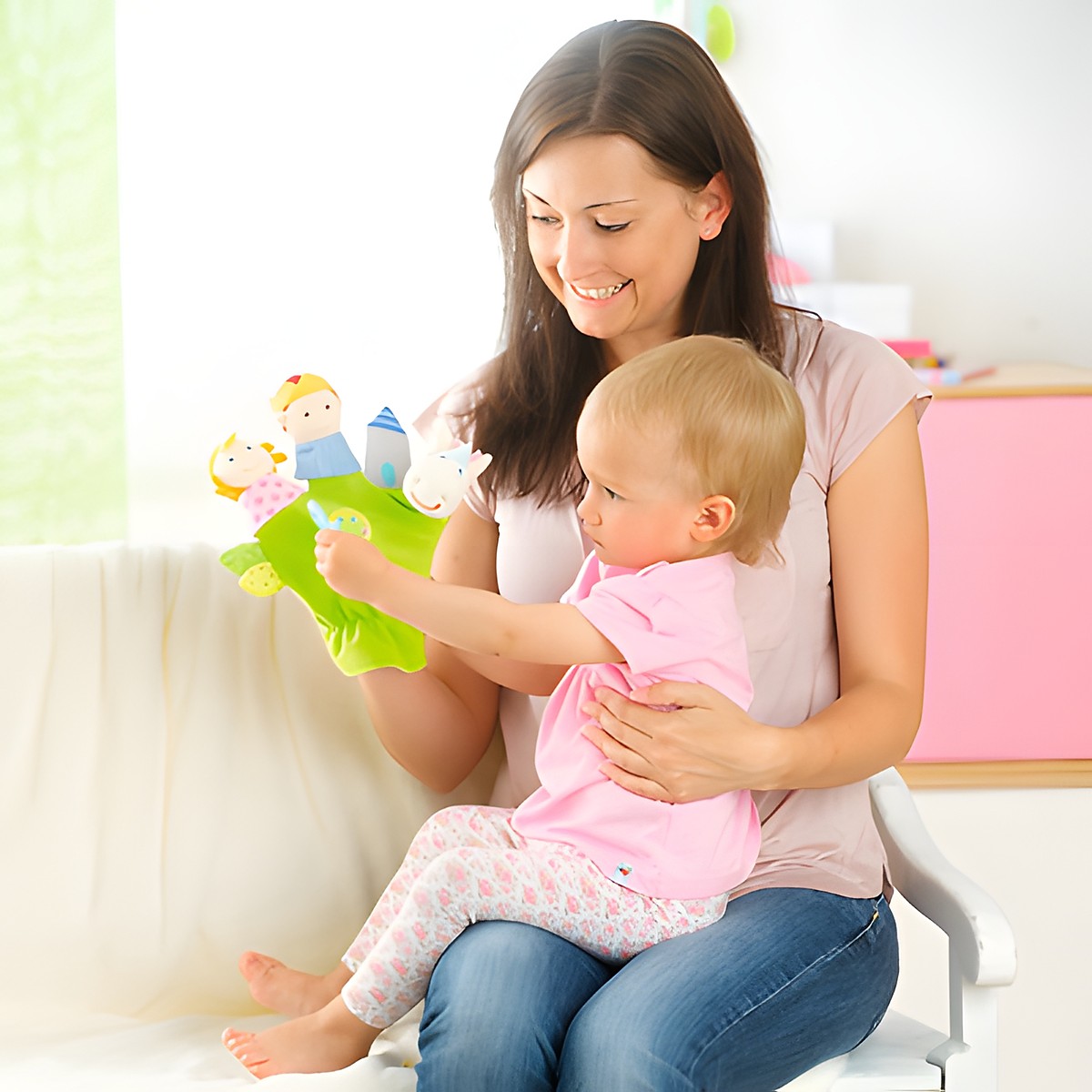 HABA fairy tale finger puppet glove, lifestyle photo of a mother playing with her baby