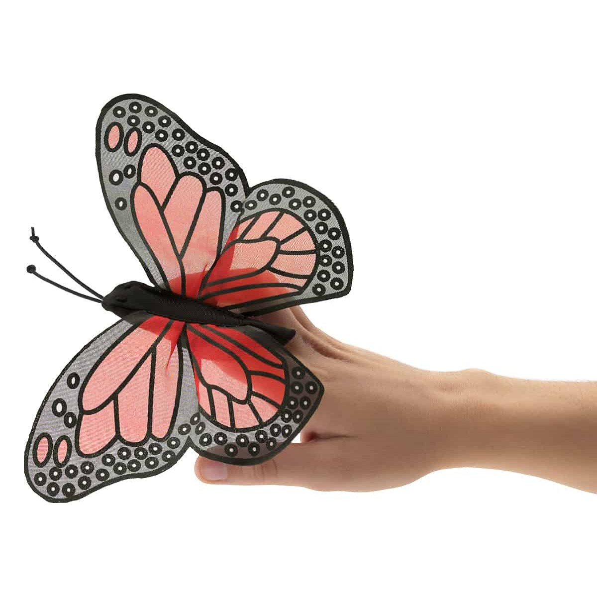 Folkmanis mini monarch butterfly finger puppet with pink-and-black wings, worn on a finger, side view
