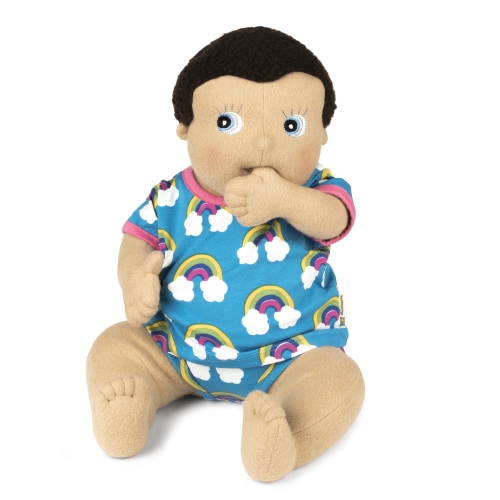 Rubens Barn baby doll Morra in the rainbow outfit, thumb at its mouth