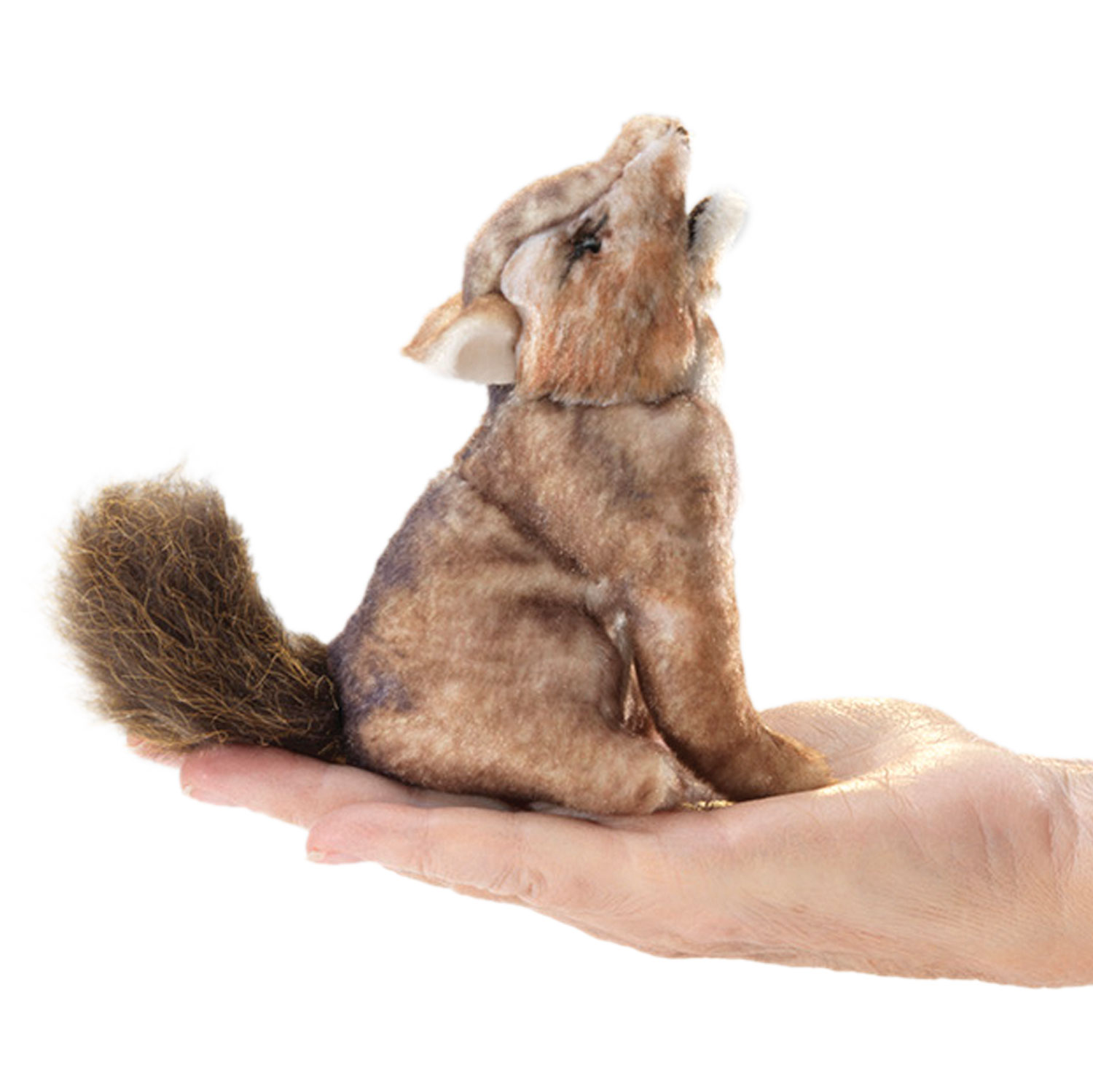Folkmanis mini coyote finger puppet in brown-grey plush, howling on a palm, with a bushy tail, side view