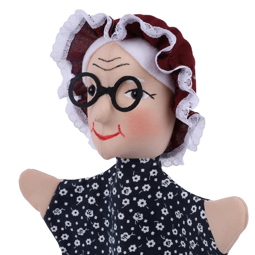 Grandmother hand puppet by munabo, close-up with forehead wrinkles, round glasses and lace-trimmed bonnet.