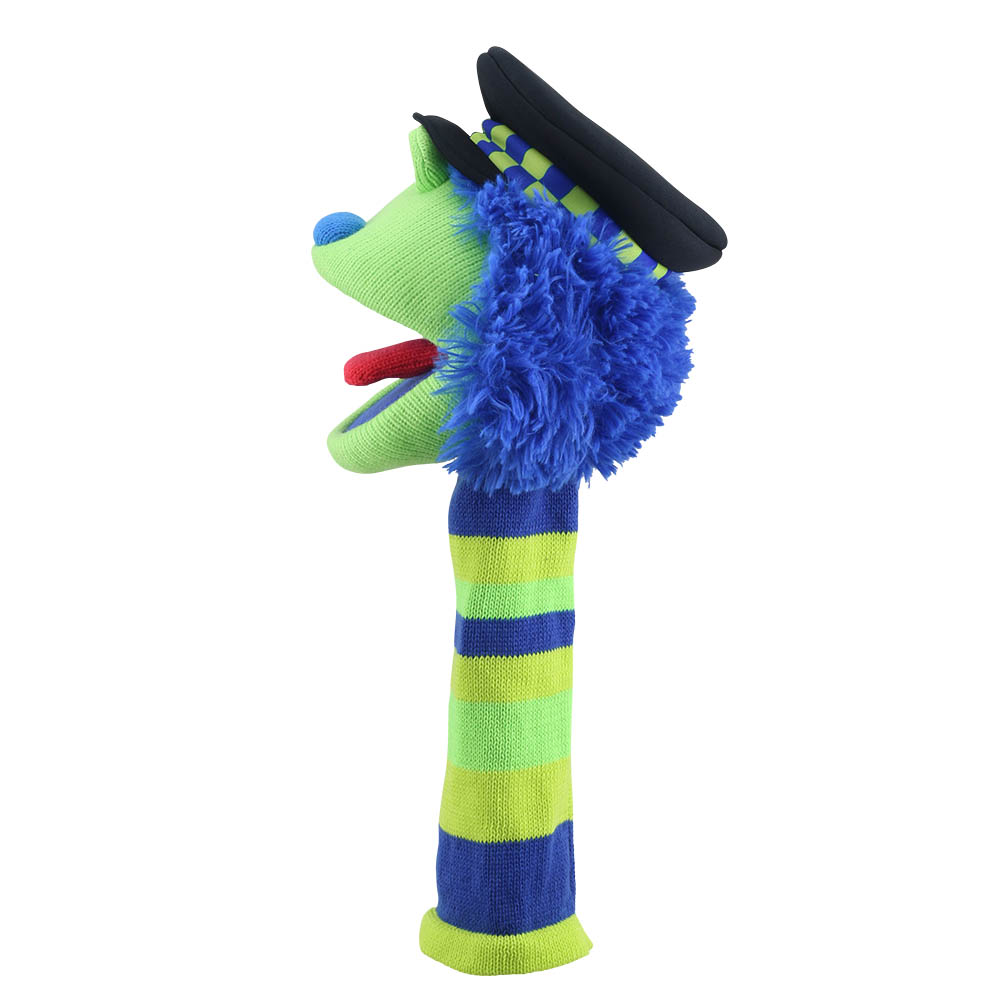 Puppet Company Bobby monster sock puppet from a rear three-quarter angle, mouth open to the left, dense blue fringed mane and black police cap