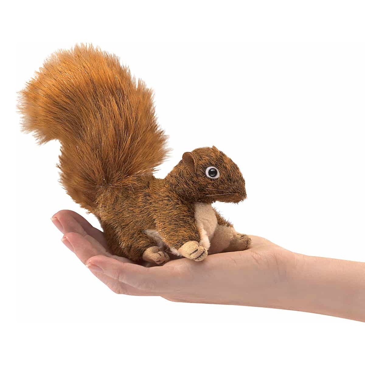 Folkmanis mini reddish-brown squirrel finger puppet with a bushy tail resting on an open palm