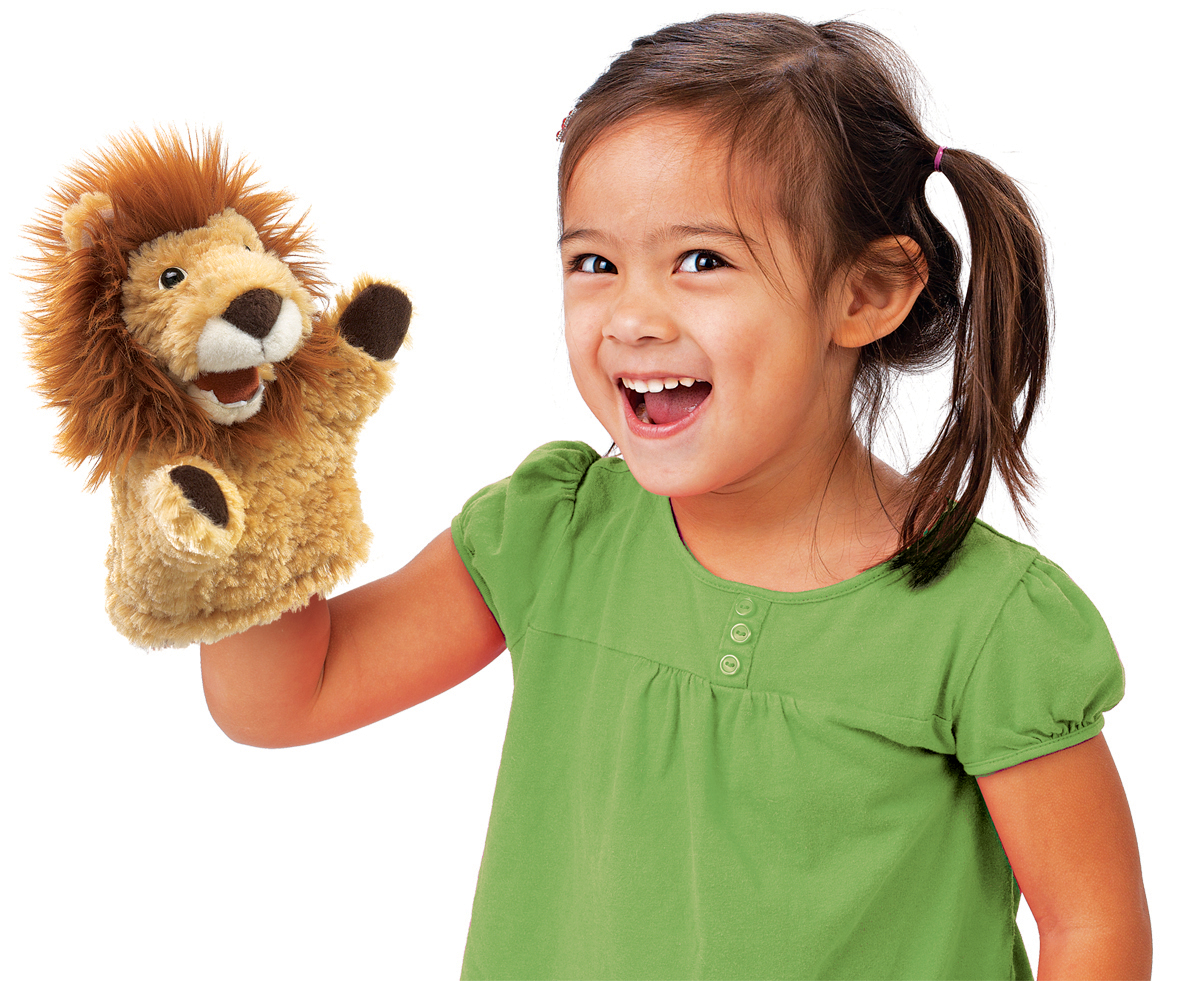 Laughing girl holding up a Folkmanis lion hand puppet with a bushy mane on her hand