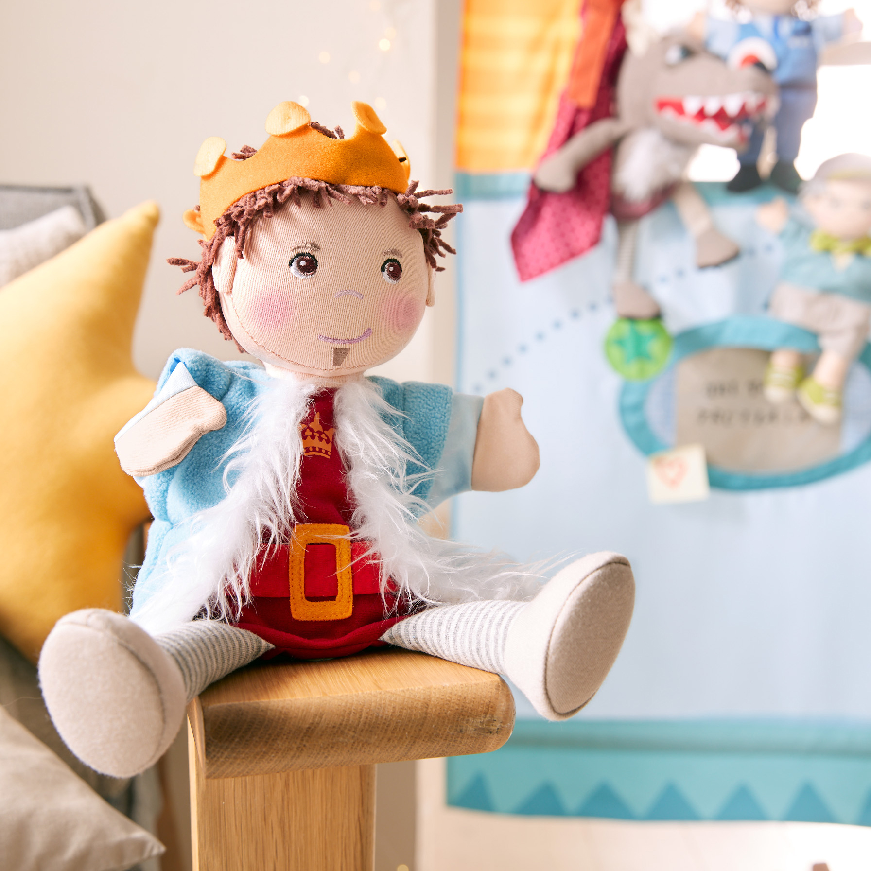 HABA baby hand puppet Prince Emir, lifestyle photo in front of a puppet theatre