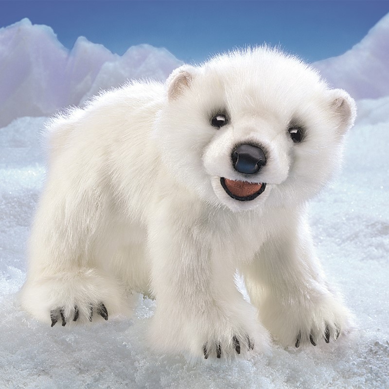 Folkmanis polar bear cub hand puppet with white plush fur, open mouth and dark claws against an iceberg backdrop