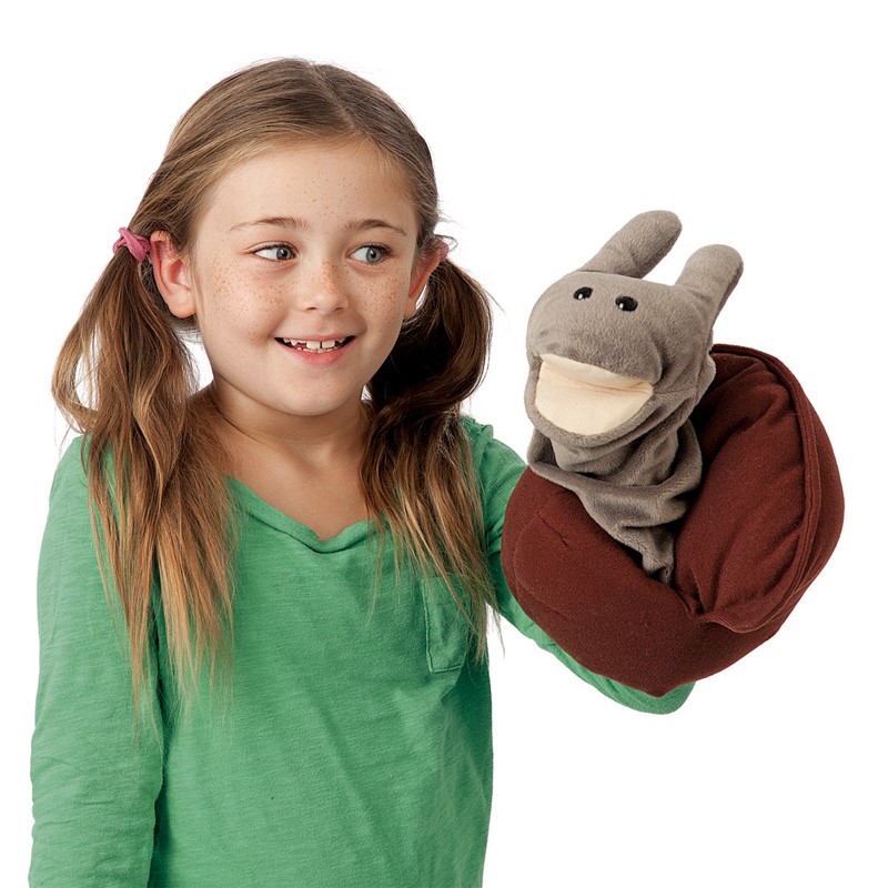 Girl in green top plays with the grey and brown Folkmanis Snail hand puppet on her hand