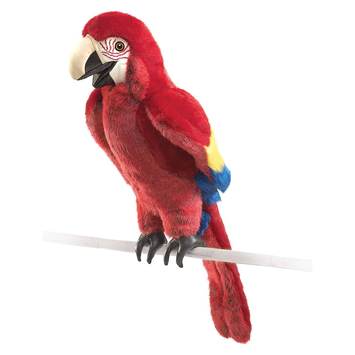 Folkmanis scarlet macaw hand puppet in vivid red with yellow-blue wing accents, perched on a bamboo stick, side view