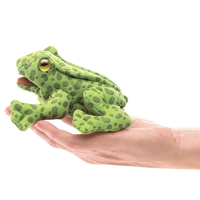 Folkmanis mini frog finger puppet in light green with dark green spots, lying on a hand, side view