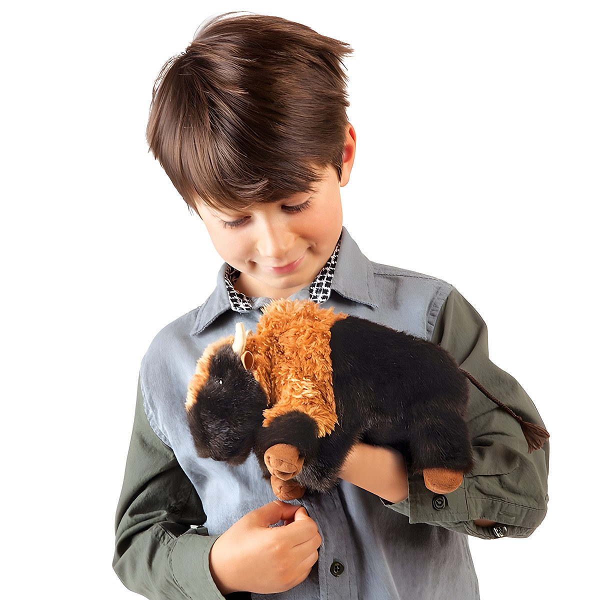 Boy holding a Folkmanis small bison hand puppet with brown and black fur and horns in both hands