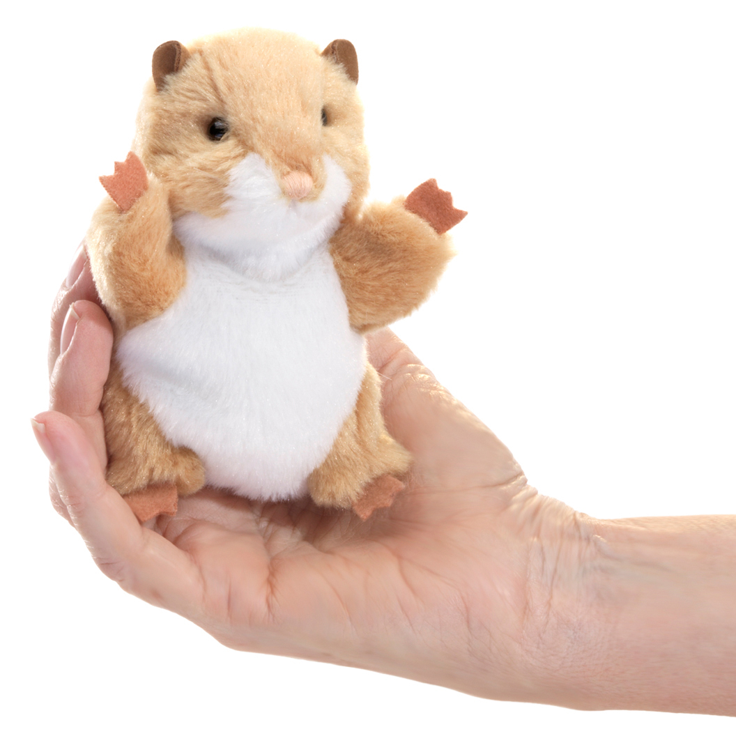 Folkmanis mini finger puppet hamster with beige fur and white belly lying on a palm, front view