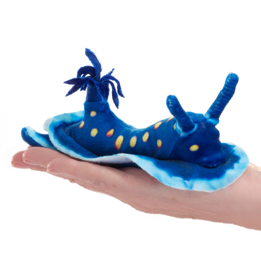 Folkmanis mini ocean slug finger puppet in vivid blue with yellow spots, lying on a palm