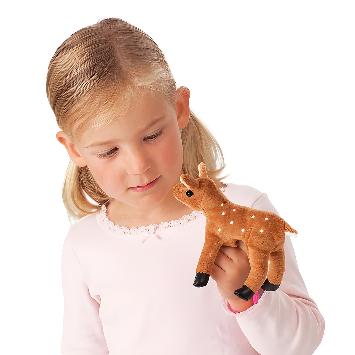 Girl wearing a Folkmanis mini fawn finger puppet in brown with white spots on her finger