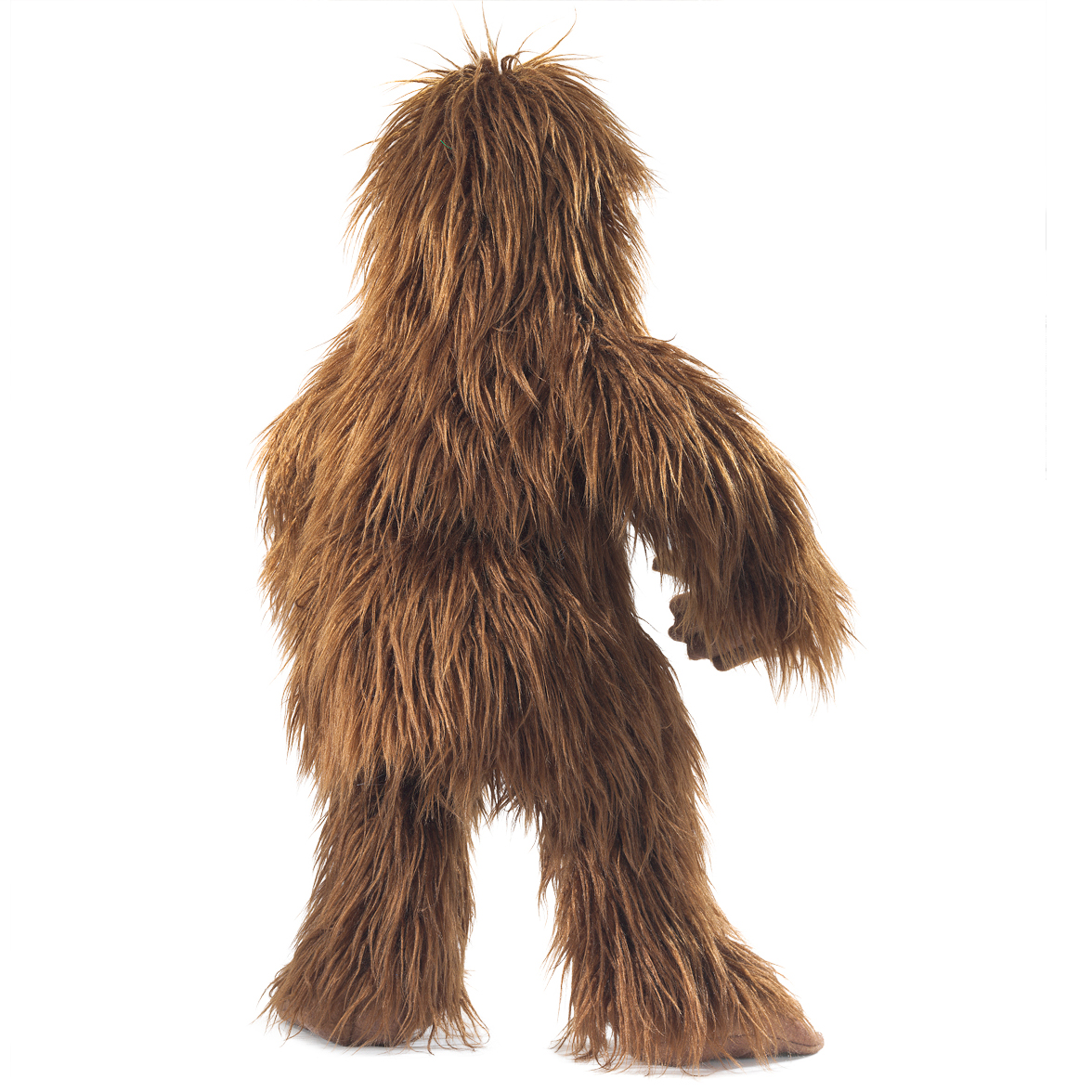 Folkmanis Bigfoot hand puppet with shaggy brown long-hair fur, shown standing in side view on a white background