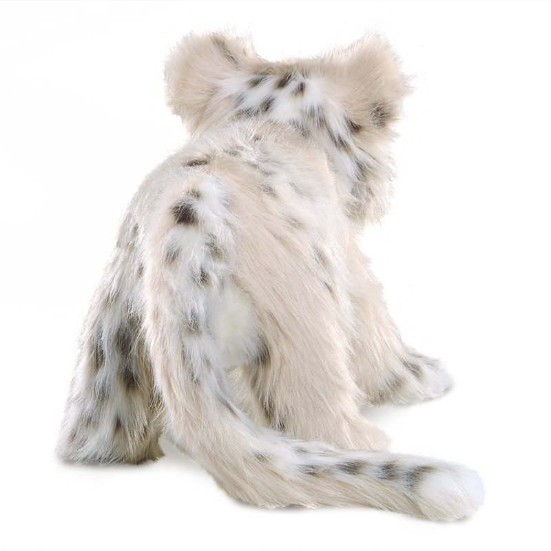 Folkmanis baby snow leopard hand puppet seen from behind, with cream-coloured plush fur, dark spots and a long tail