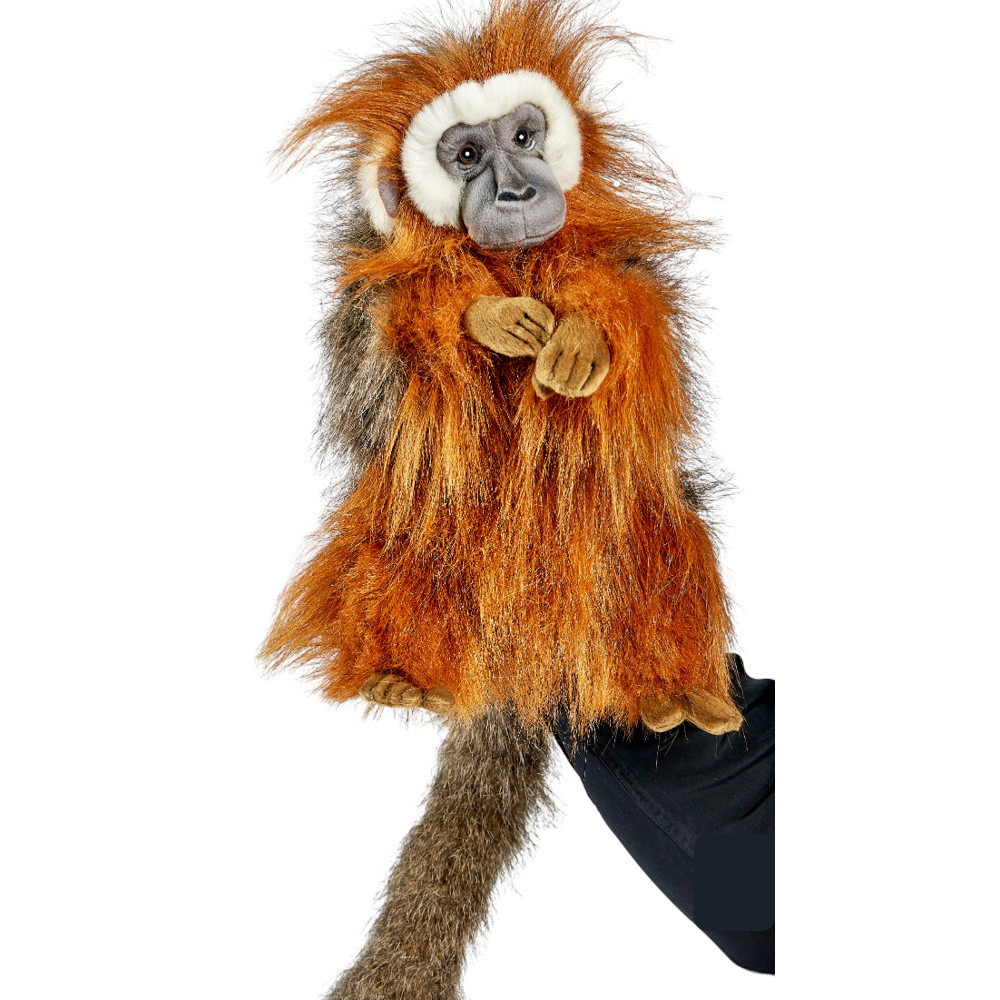 Titi monkey hand puppet by Hansa Creation with shaggy russet fur, a grey face and a long tail