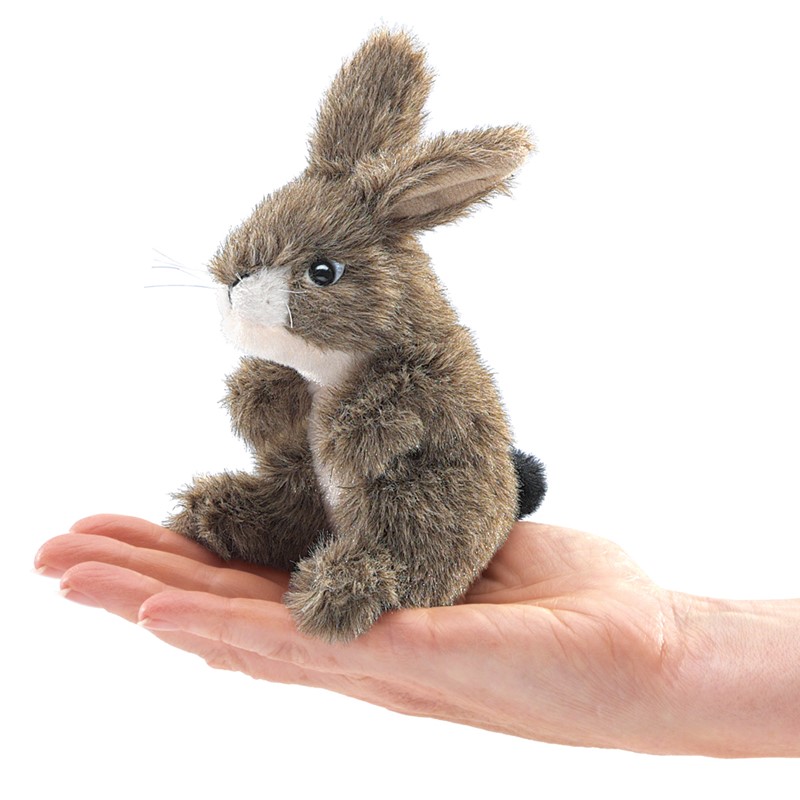 Folkmanis mini finger puppet jackrabbit in grey-brown, sitting on a palm, side view