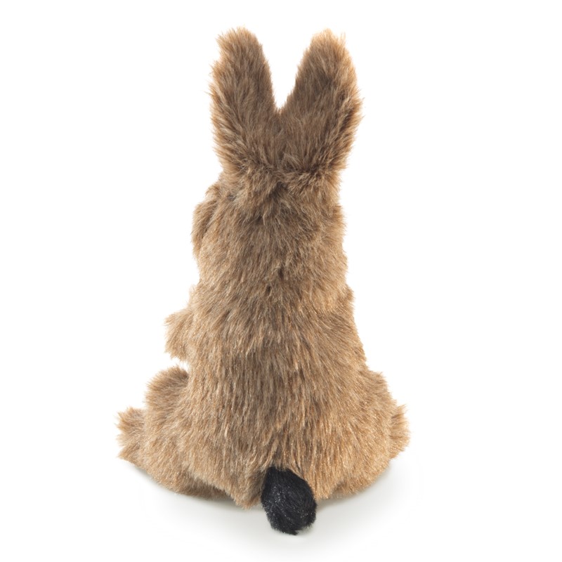 Folkmanis mini jack rabbit finger puppet shown from the back, with brown mottled fur, black tail and upright ears