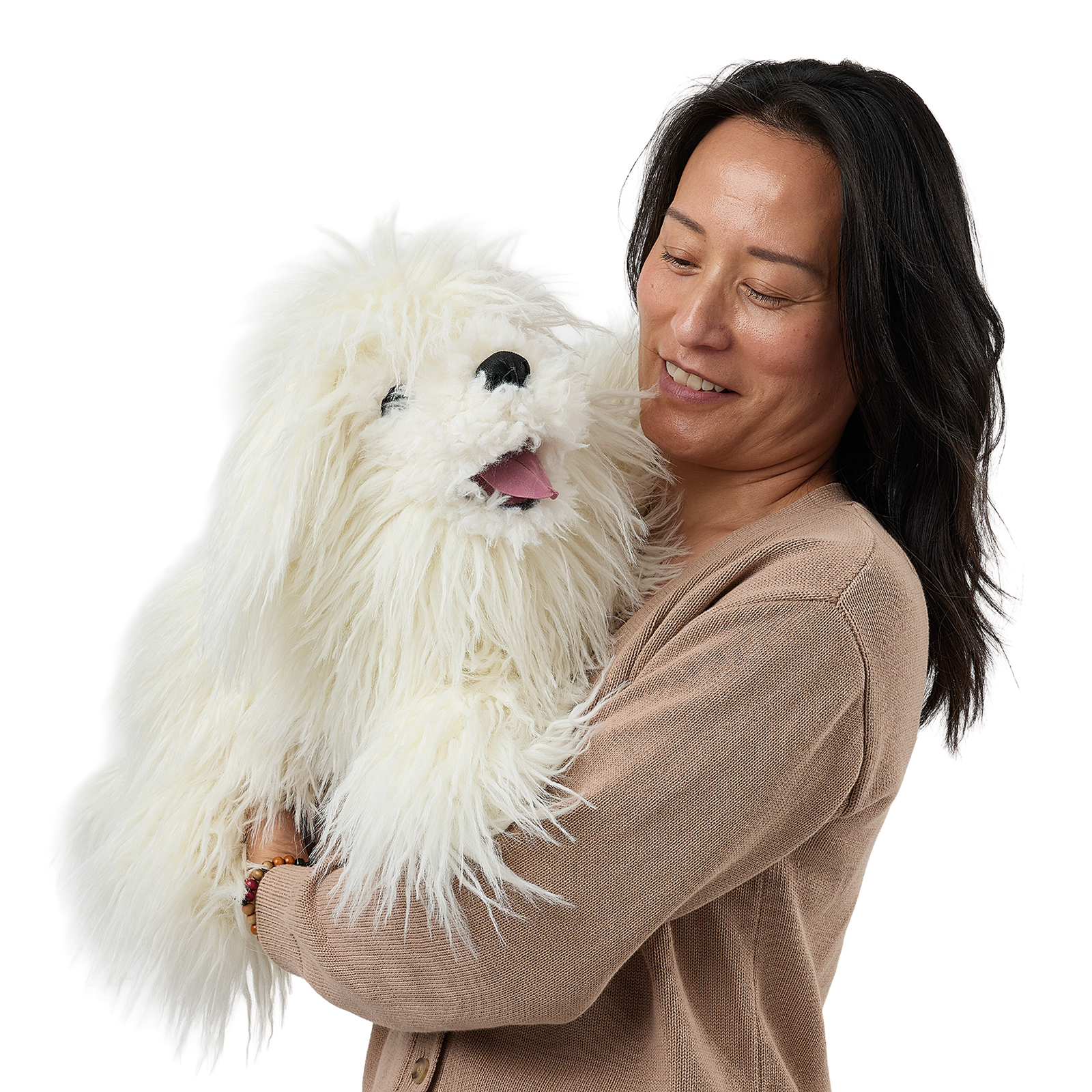 Folkmanis Komondor hand puppet on a woman's arm, a front view with its mouth open.