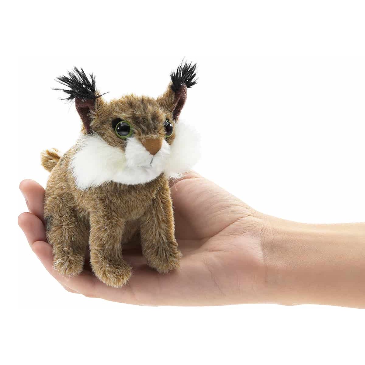Folkmanis mini bobcat finger puppet with spotted fur, black tufted ears and white cheek ruff, resting on a palm