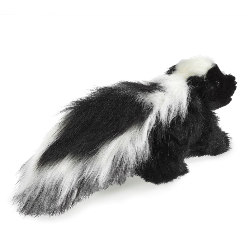 Folkmanis skunk hand puppet in black and white with a bushy tail, standing in side view