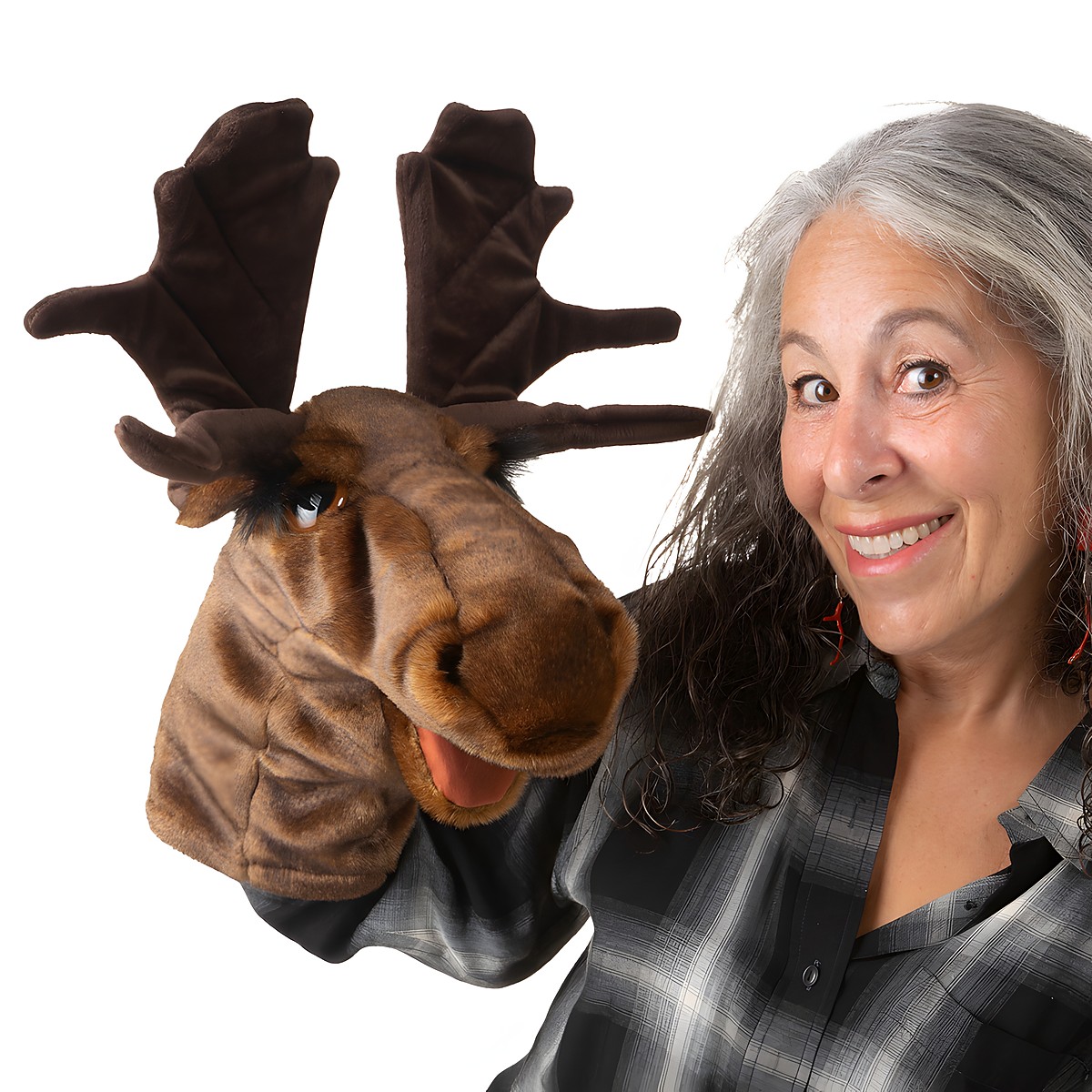 Folkmanis moose hand puppet with large antlers, brown plush fur and movable mouth, worn on the hand by a woman.