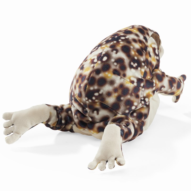 Folkmanis Desert Rain Frog hand puppet with brown and beige spotted pattern, photographed lying down from a slightly overhead angle