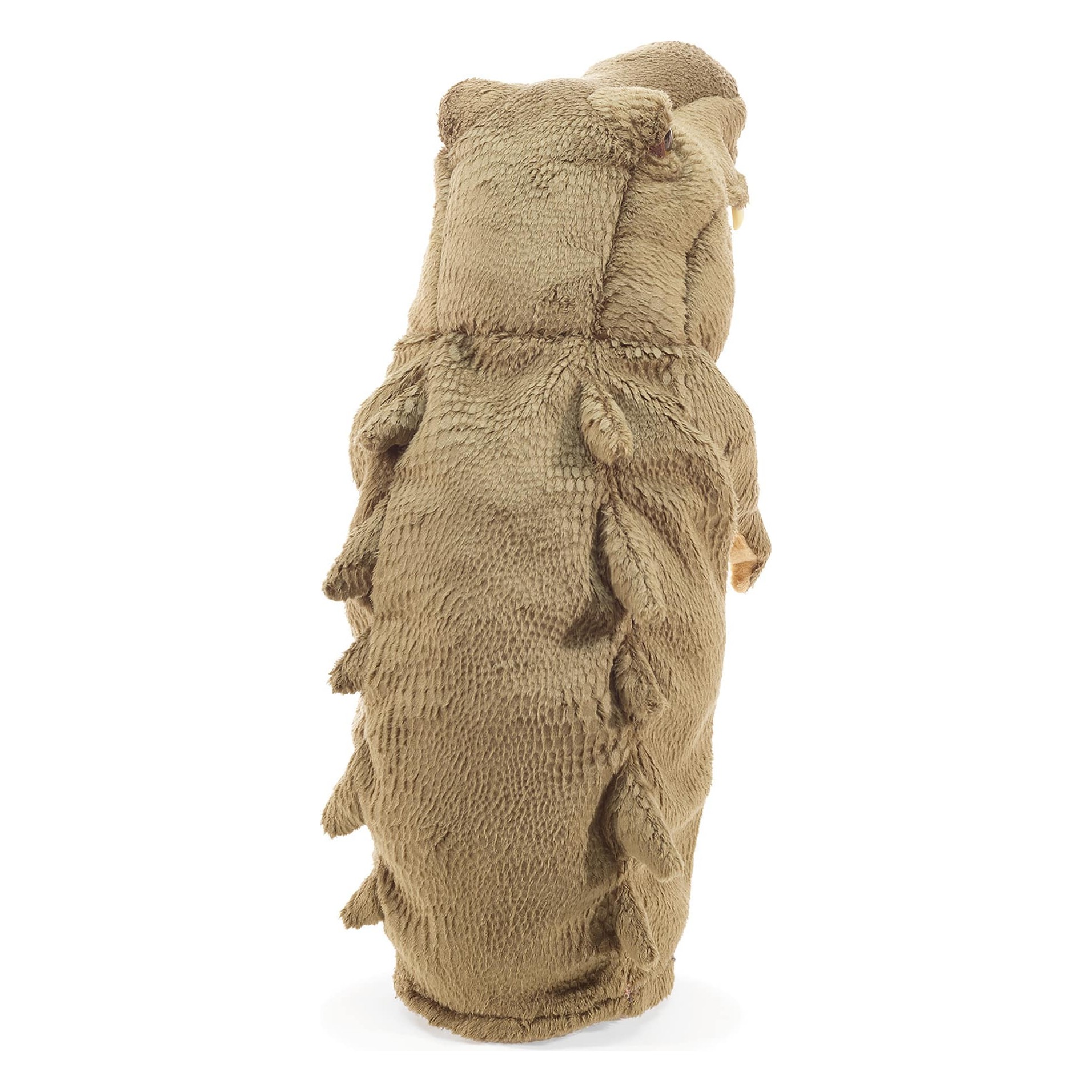 Folkmanis crocodile hand puppet seen from behind, beige-brown scale pattern in textured plush, standing upright