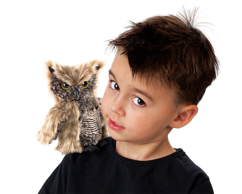Boy with Folkmanis screech owl hand puppet on his shoulder, brown-grey patterned plumage, yellow eyes