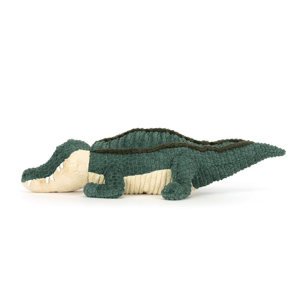 Jellycat plush toy alligator Allexi, side view with a long tail and cream-coloured snout