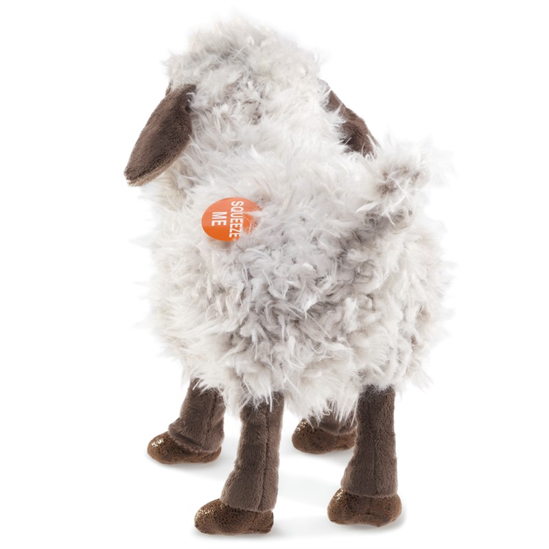 Folkmanis hand puppet bleating sheep with shaggy white plush coat, brown head and hooves, standing viewed from the rear at an angle