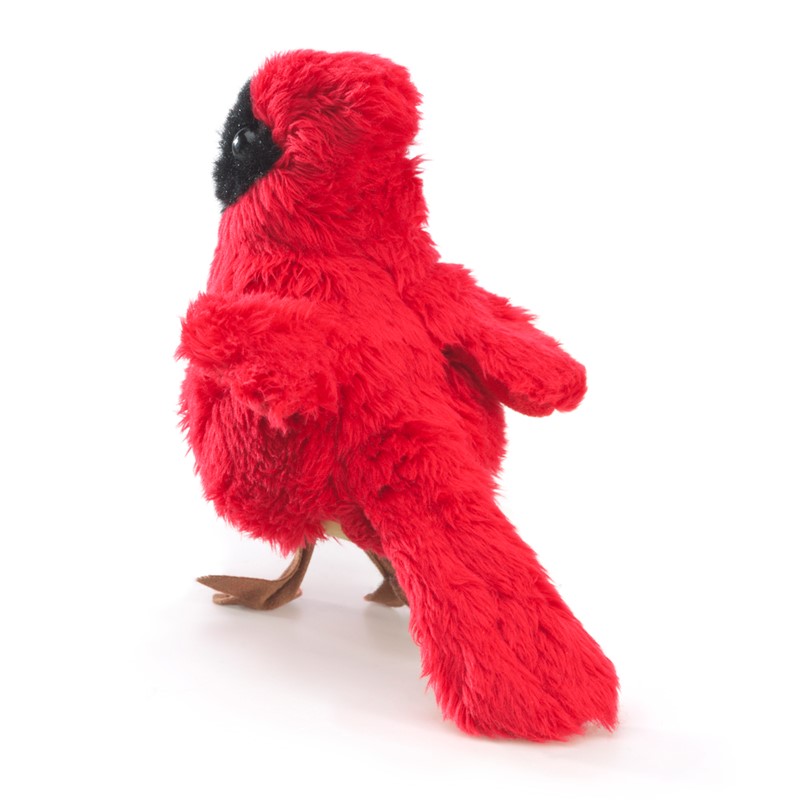 Folkmanis mini cardinal finger puppet in bright red with a black face mask and brown feet, shown at an angle