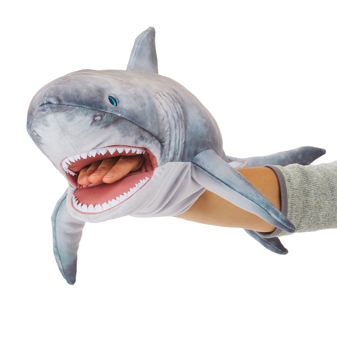 Folkmanis great white shark hand puppet in grey with open mouth and white teeth, worn on a hand
