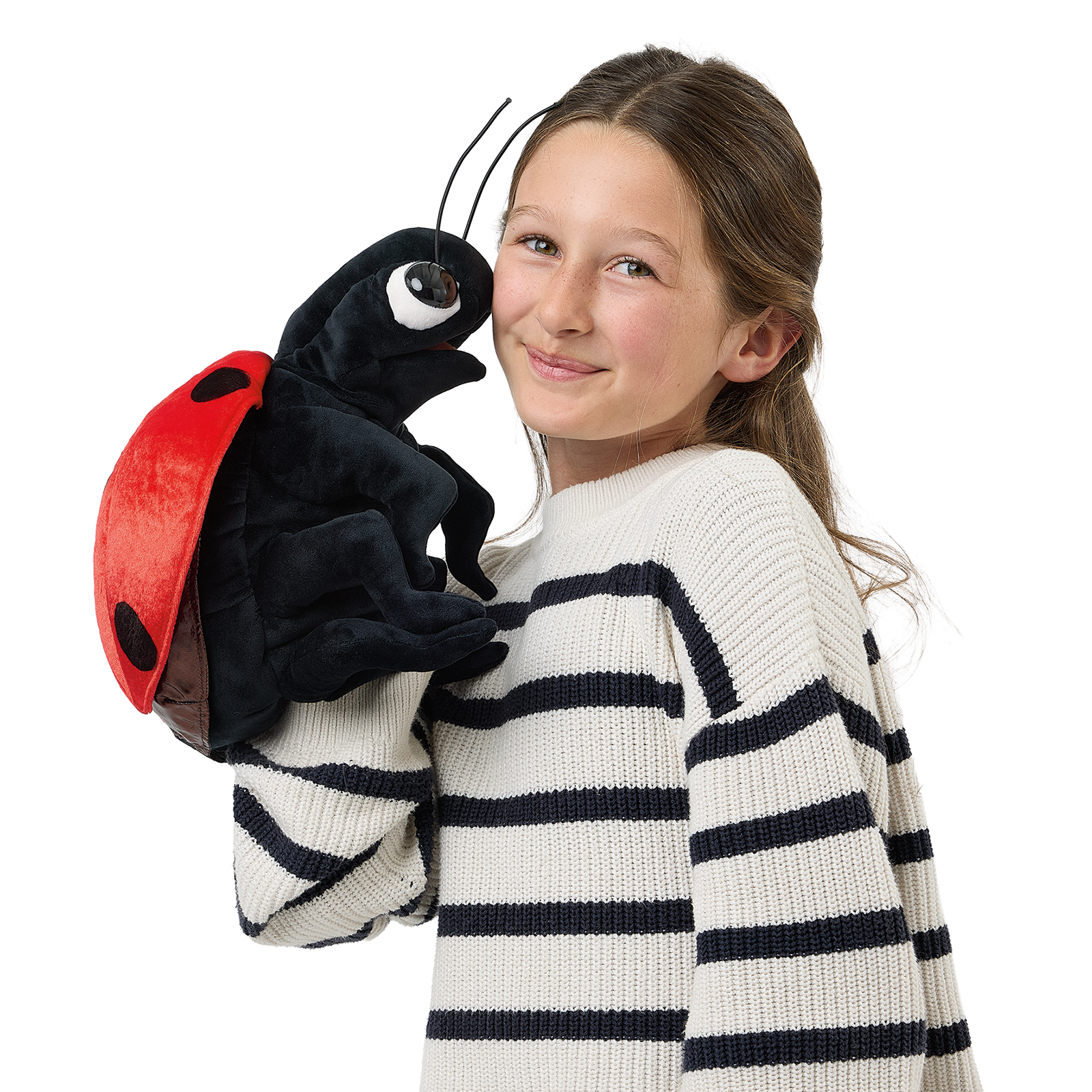 Folkmanis ladybird hand puppet on a girl's shoulder, a close view with its mandibles open and antennae raised.